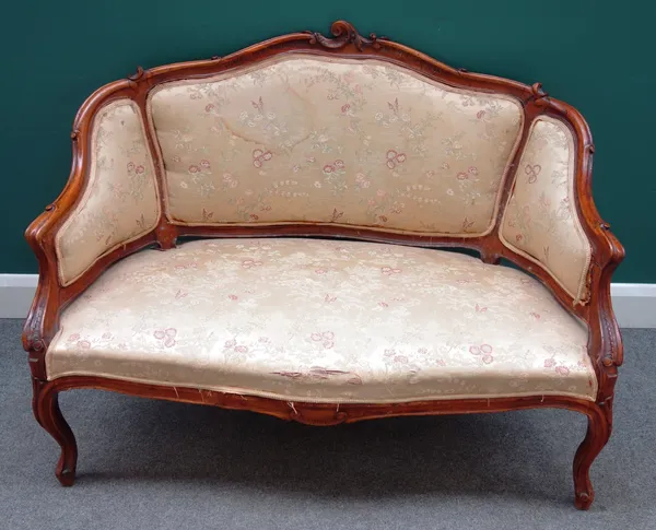 A small Louis XV style carved walnut frame sofa with serpentine seat,  123cm wide x 89cm high x 72cm deep.