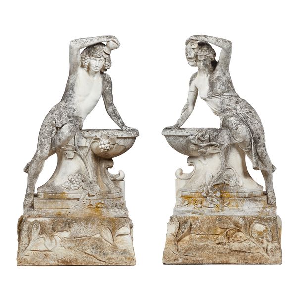 A pair of reconstituted stone figures, both cast as a semi-clad male and female drinking from a well, each on a floral moulded square base, 64cm wide
