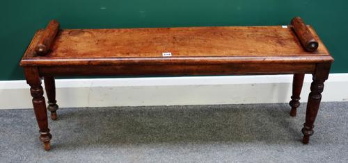 After Heathcote Tatham, a Victorian mahogany window seat with turned end stops and supports, 112cm wide x 48cm high x 27cm deep.