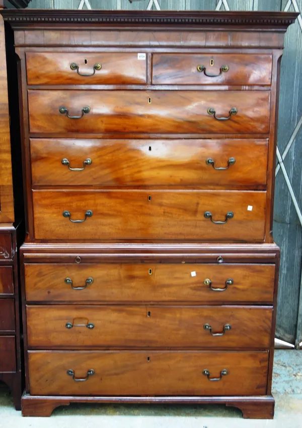 A George III mahogany chest on chest of two short and six long graduated drawers divided by brushing slide on bracket feet. 120cm wide x 181cm high x