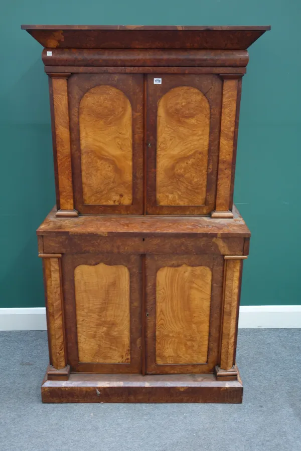 A 19th century Continental burr ash, pollard oak and walnut double height side cabinet, each with pair of arch top doors enclosing a fitted interior,
