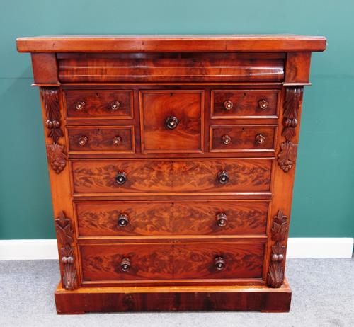 A 19th century Scottish mahogany chest, with one long cushion drawer over five various short drawers, on a plinth base, 132cm wide x 146cm high x 58cm
