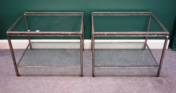 A pair of 20th century silvered metal and glass rectangular two tier occasional tables, 76cm wide x 57cm high x 56cm deep.