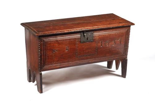 A small 17th century oak five plank coffer, with chip work decoration, the front panel carved 'NB 1651', 83cm wide x 49cm high x 35cm deep.  Illustrat