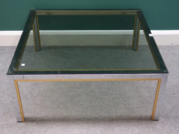 A 20th century polished steel and brass glass inset coffee table on block supports, 91cm wide x 38cm high.
