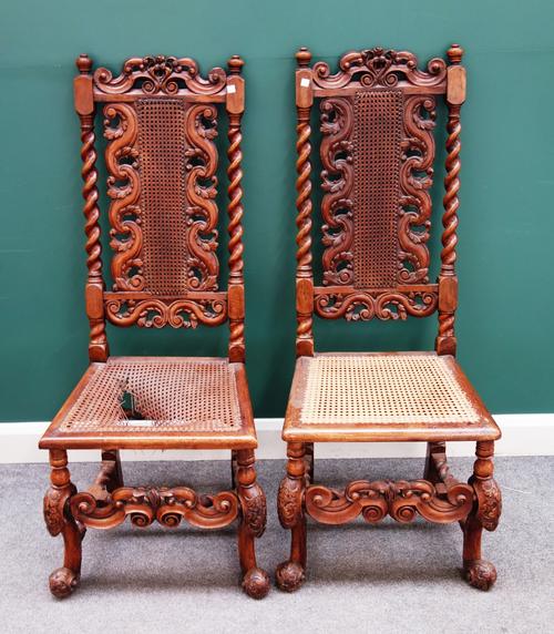 A pair of late 17th century walnut framed caned back and seat side chairs, 51cm wide x 126cm high x 54cm deep.