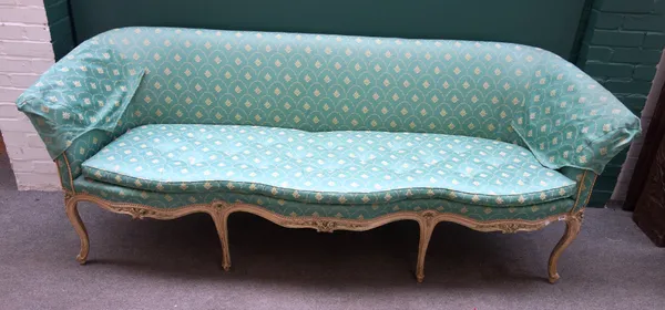 A Louis XV style green upholstered sofa, with triple serpentine front and floral carved cream painted frame, 233cm wide x 90cm high x 76cm deep.