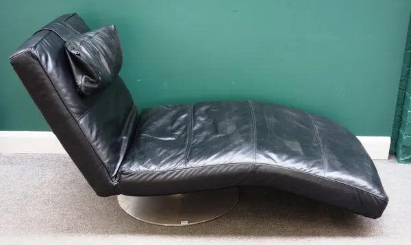 Habitat; a 20th century black leather upholstered chaise longue, on a circular polished steel base, 200cm long x 85cm high.
