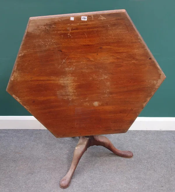 A mid-18th century mahogany occasional table, with hexagonal snap top on bird cage mount and tripod base, 106cm wide x 76cm high.