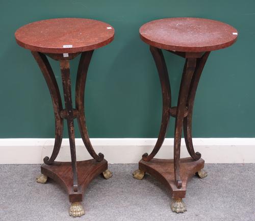 A pair of 18th century style jardiniere stands, each with circular marble tops over three open sabre supports, on gilt metal lions paw feet, 39cm wide