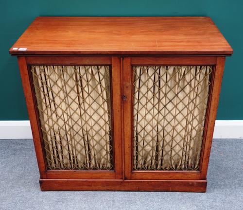 A Regency and later mahogany side cabinet, with pair of brass grille doors on plinth base, 97cm wide x 87cm high x 49cm deep.