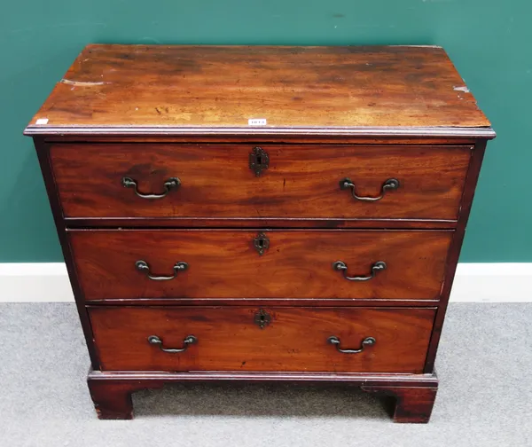 A George III mahogany chest with three long graduated drawers on bracket feet, 85cm wide x 82cm high x 44cm deep.