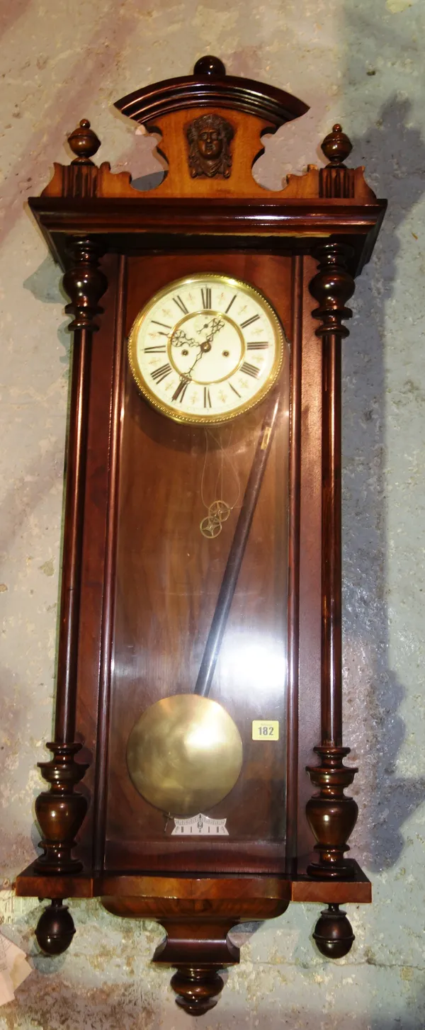 A mahogany cased Vienna wall clock, (weights, key and pendulum).  S3T