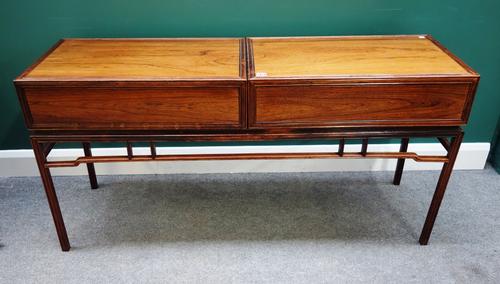 Possibly Fritz Henning; a mid-20th century rosewood sideboard, with pair of lift-off compartments, each with single drawer, on channelled square suppo