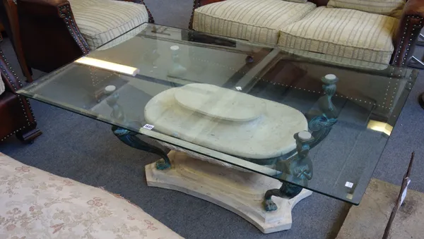 A 20th century coffee table, the bevelled rectangular glass top on four female monopedia supports, 130cm wide x 80cm deep x  80cm high.