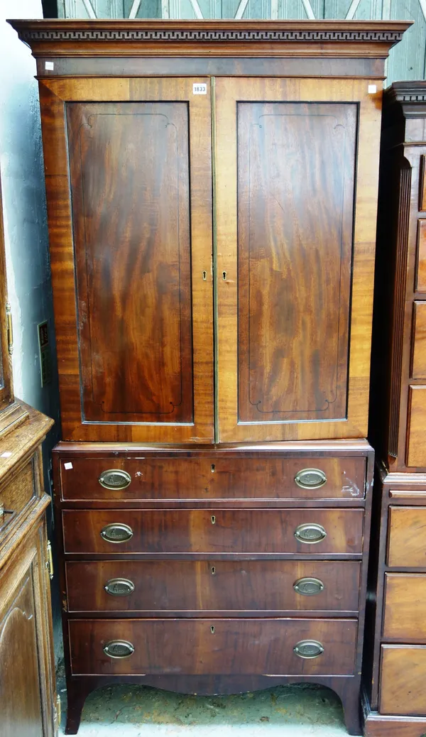 A small George III inlaid mahogany linen press, with pair of panel doors over four long graduated drawers, on splayed bracket feet, 92cm wide x 195cm
