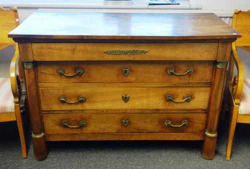 An early 19th century French gilt metal mounted fruitwood and walnut four drawer commode with split turned columns, 127cm wide x 87cm high x 58cm deep