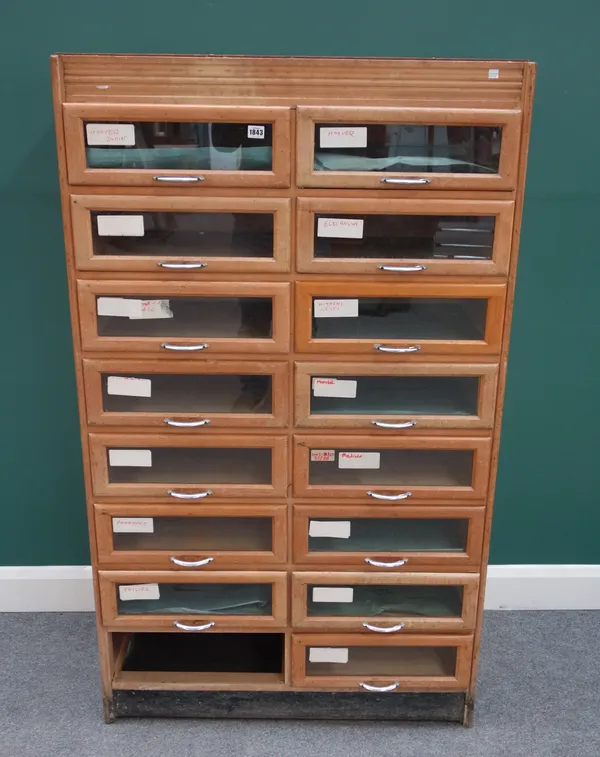 A 20th century beech sixteen drawer haberdashery cabinet (one drawer lacking) 91cm wide x 154cm high x 46cm deep.