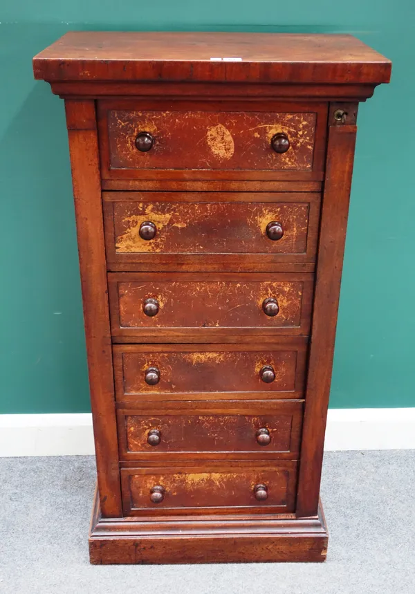 A 19th century mahogany Wellington chest, with six leather fronted drawers, enclosed by locking bar, on plinth base, 61cm wide x 122cm high x 38cm dee