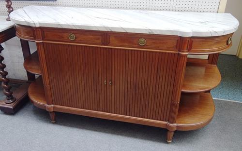 A Louis XVI style buffet, the 'D' shaped marble top over three frieze drawers and cupboard, flanked by rounded open shelves, on tapering fluted suppor