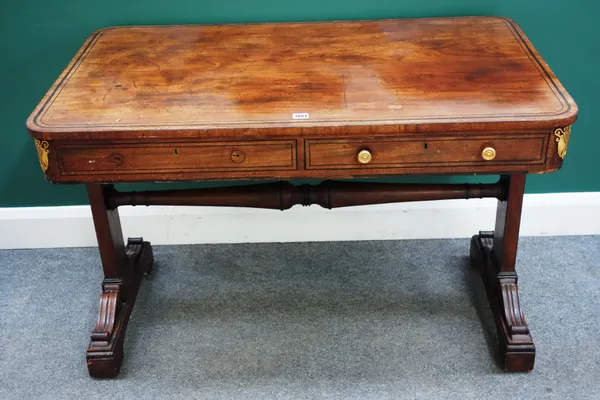 A George III gilt metal mounted mahogany rounded rectangular centre table, on trestle end supports, 113cm wide x 74cm high x 67cm deep. (one drawer la