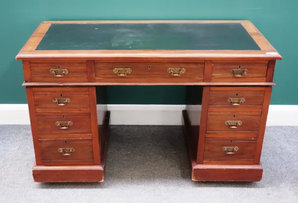 An early 20th century walnut pedestal desk, with nine drawers about the knee, 122cm wide x 75cm high x 60cm deep.
