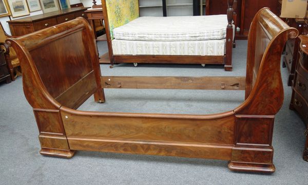 A 19th century French mahogany lit en bateau, with roll over ends, 114cm wide x 110cm high x 173cm long.