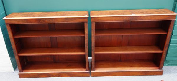 A pair of figured walnut floor standing open bookcases, on plinth base, 110cm wide x 98cm high x 27cm deep, (2).