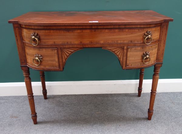 A small William IV inlaid mahogany bowfront sideboard, with three frieze drawers on turned supports, 102cm wide x 52cm deep x 82cm high.