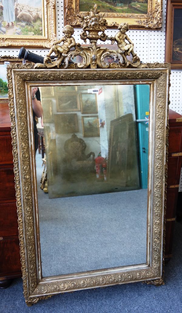 A 19th century gilt framed rectangular wall mirror, the crest cast as a vase of flowers flanked by cherubs, 80cm wide x 155cm high.