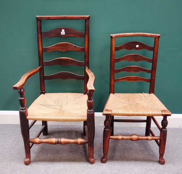 A set of eight George III ash and oak Lancashire ladder back dining chairs, with turned supports, to include a pair of carvers, (8).