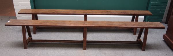 A pair of 19th century French chestnut rectangular benches, each on six splayed block supports united by stretcher, 250cm long x 43cm high x 32cm wide