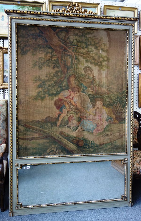 A large early 20th century grey painted parcel gilt trumeau wall mirror, with ribbon tied crest and painted tapestry panel over mirror plate, 147cm wi