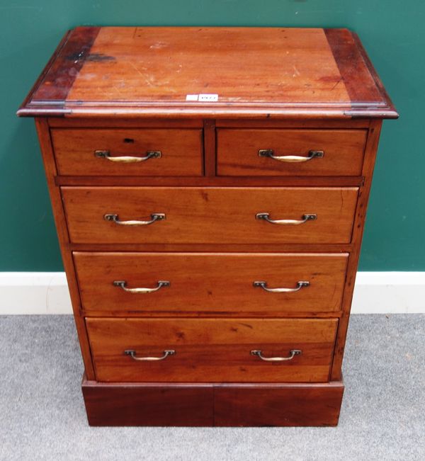 A small mahogany and walnut chest of two short and three long drawers, on plinth base, 63cm wide x 83cm high x 41cm deep.