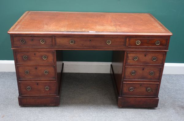 A 19th century mahogany pedestal desk, with nine drawers about the knee, on plinth base, 136cm wide x 74cm high x 71cm deep.