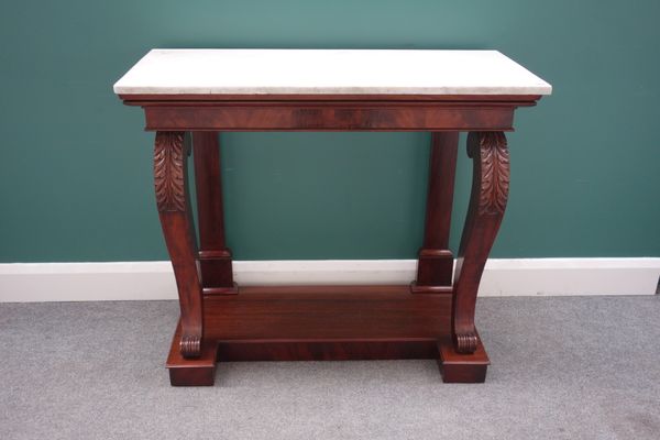 A mahogany console table, the rectangular marble top on a pair of 'S' scroll supports, 102cm wide x 88cm high x 47cm deep.