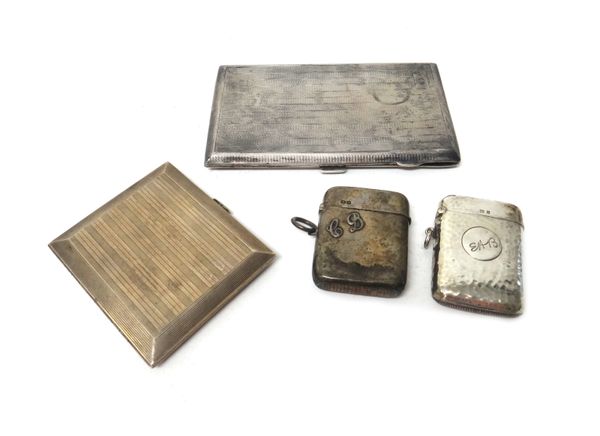 A late Victorian silver vesta case, with applied initials, Chester,1899, a silver vesta case, with beaten finish,Birmingham,1906, a silver rectangular