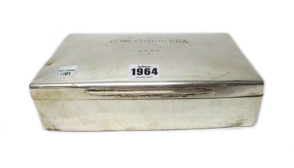 A large late Victorian silver mounted cigarette box, of plain rectangular form, the cover presentation engraved, the interior wooden lined with triple