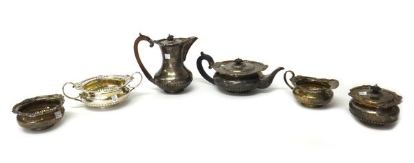 A Victorian silver three piece tea set, of compressed circular form, the applied cast borders, decorated with masks and scrolling leaves, the body hav