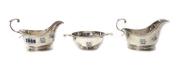 Silver, comprising; a pair of sauceboats, each with a scrolling handle, Birmingham 1932 and a Scottish twin handled quaich, Edinburgh 1925, combined w