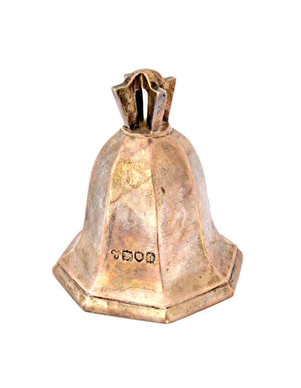 A silver table bell of octagonal tapering form, London 1905, height 8.5cm, weight 262 gms.  Illustrated