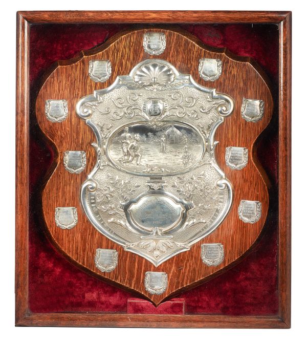 A Victorian silver bowls trophy, the central shield shaped panel depicting a bowling scene on the green and detailed Campbeltown Bowling Club Challeng