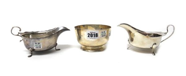 Silver, comprising; a circular bowl, engraved with a name, raised on a circular foot, London 1920, and two sauceboats, Chester 1906 and Birmingham 197