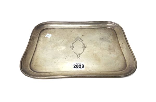 A silver shaped rectangular dressing table tray, the centre engraved with an oval vacant cartouche, Birmingham date letter rubbed, size 29.5cm x 21.5c