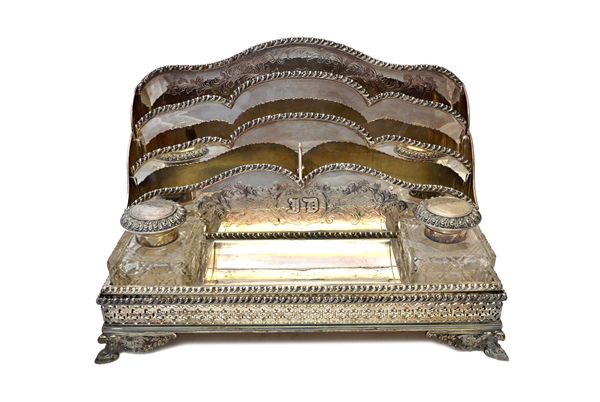 An early 20th century silver plated on copper two piece desk set, comprising; a twin bottle rectangular inkstand, with a pierced gallery border, with