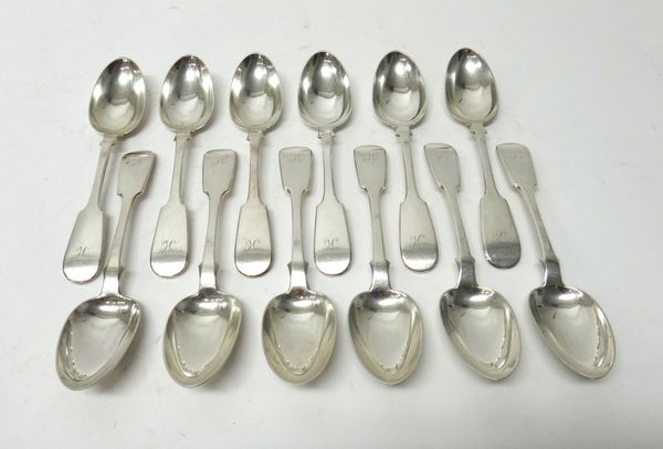 A set of twelve Scottish silver fiddle pattern dessert spoons, each engraved with the initial K, Glasgow 1858, combined weight 672 gms.