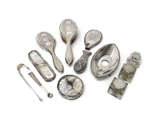 Silver and silver mounted wares, comprising; a single bottle inkstand of shaped oval form, with a beaded rim, raised on four feet, Sheffield 1912, wit