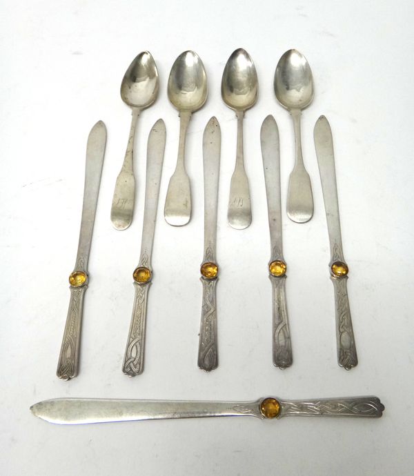 A set of six Scottish silver letter openers, each with Celtic inspired decoration to the handle and mounted with a circular cut citrine, Edinburgh 192