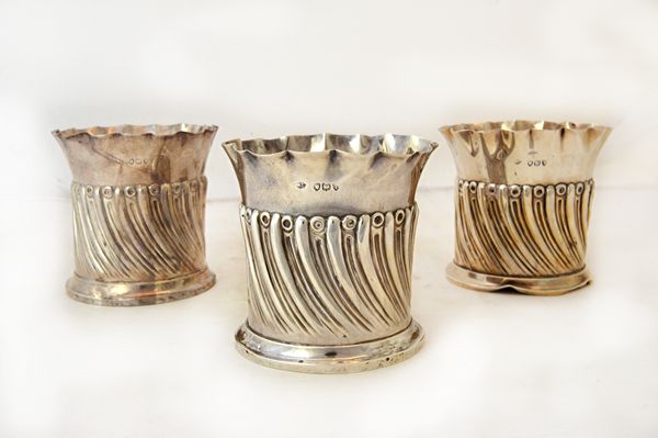 A set of three Victorian silver fern pot stands, each with semi-spiral fluted decoration, within a shaped rim, London 1894, combined weight 466 gms, (