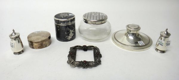 Silver and silver mounted wares, comprising; a capstan shaped hinge lidded inkstand, fitted with a glass liner, Birmingham 1935, a circular glass powd